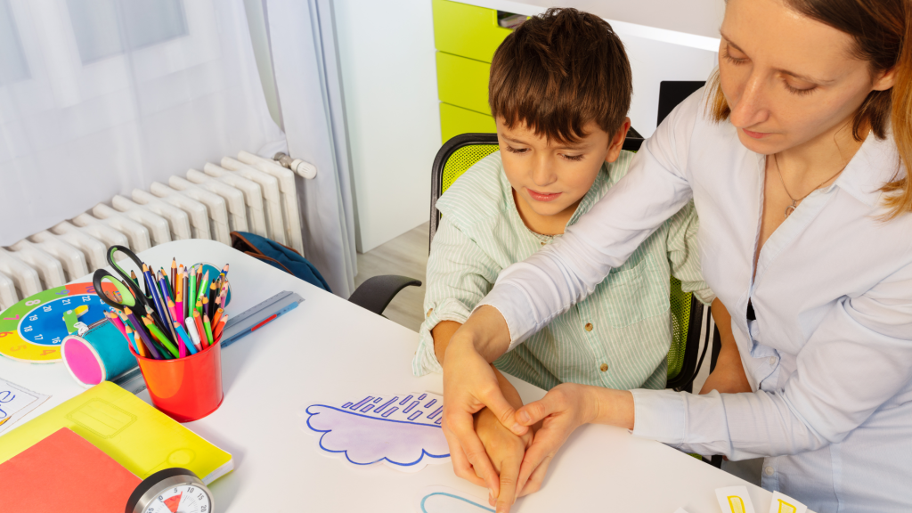 A woman and child diligently crafting together, showcasing their creativity and bond.